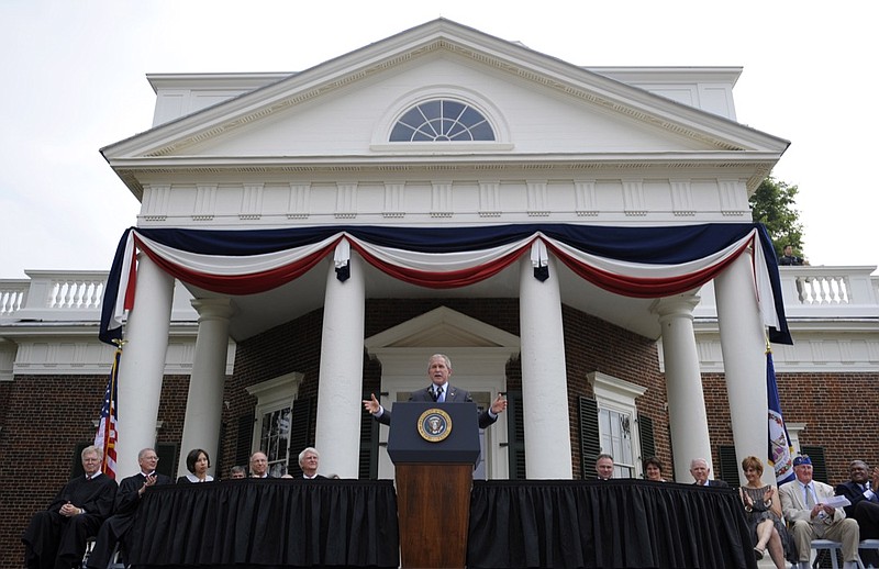 In this July 4, 2008, file photo, President Bush gestures during remarks at Monticello's 46th annual Independence Day celebration and naturalization ceremony in Charlottesville, Va. (AP Photo/Evan Vucci)