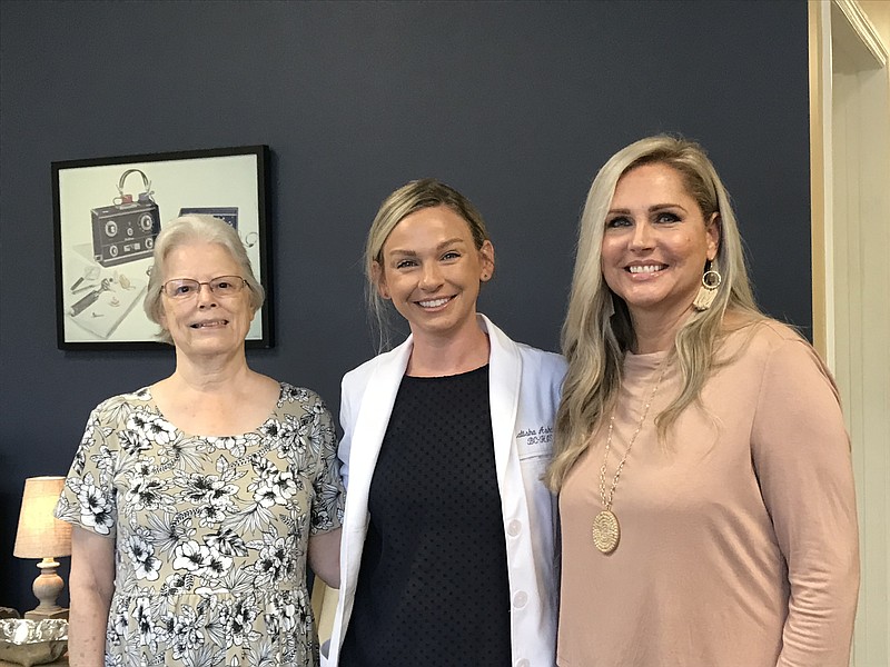 Betty Asbury, left, and Stacy Talwar, right, are pictured with Latisha Kaye Ashcraft, board certified hearing instrument specialist with Beltone Hearing Aid Centers, after being fitted for their new hearing aids. / Staff photo by Emily Crisman