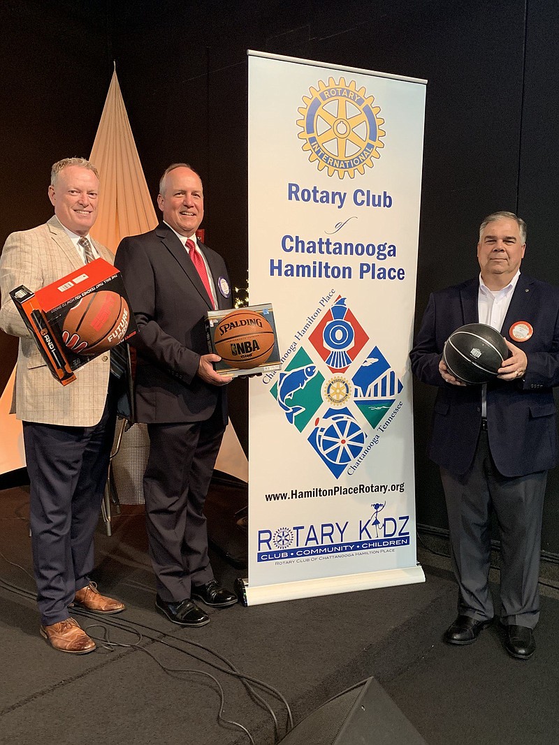 Rotary Club of Chattanooga Hamilton Place members Stan Russell, Jim Glass and Jeff Otto, from left, display basketballs collected by the club for a mission group hosting youth basketball camps in Romania. / Photo contributed by Beverlee Bartley