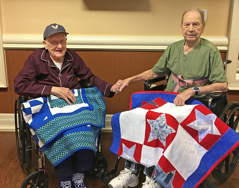 
Life Care Center of Hixson residents and World War II veterans James Gribble, left, and Mike Neal bond over the quilts they both received from Red Bank Church of Christ's Threads of Love ministry. / Photo contributed by Life Care Center of Hixson
