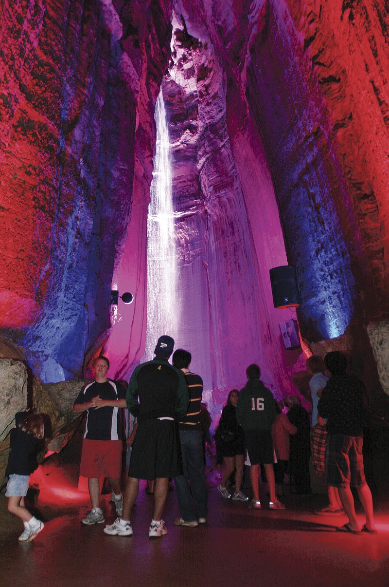 Staff Photo by Dan Henry A large group of tourists visit Ruby Falls on Friday.