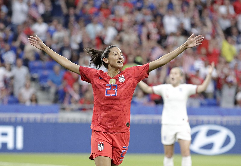 Christen Press celebrates after scoring the United States' first goal during a Women's World Cup semifinal against England on Tuesday in Lyon, France.