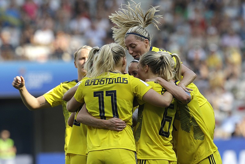 Sweden players celebrate after Kosovare Asllani scored to give the team a 1-0 lead over England in the Women's World Cup's third-place match Saturday at Stade de Nice in France. Sweden beat England 2-1 to win the quadrennial tournament's bronze medal for the third time.