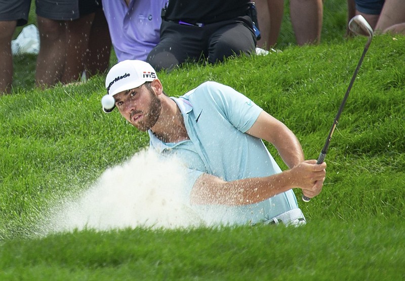 Matthew Wolff hits from a bunker on the 12th hole at TPC Twin Cities during the final round of the 3M Open on Sunday in Blaine, Minn. Wolff won the tournament, just his third as a professional golfer, to earn his first PGA Tour victory at age 20.