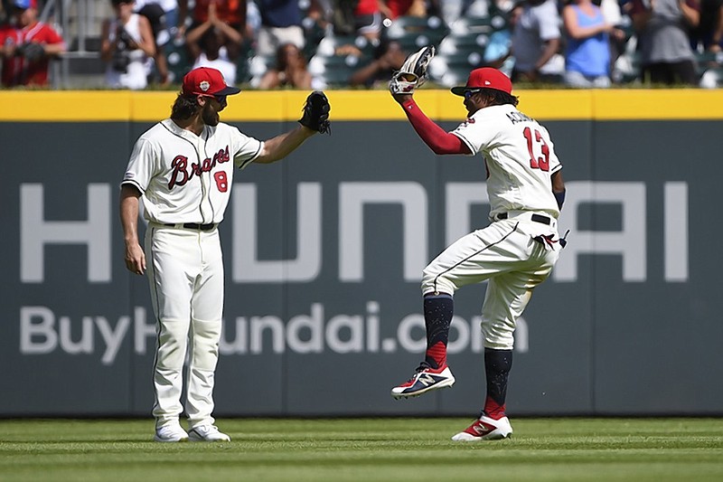 Atlanta Braves outfielders Charlie Culberson, left, and Ronald Acuna Jr. celebrate after Sunday's 4-3 home win against the Miami Marlins.