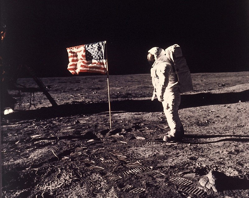 In this image provided by NASA, astronaut Buzz Aldrin poses for a photograph beside the U.S. flag deployed on the moon during the Apollo 11 mission on July 20, 1969. Television is marking the 50th anniversary of the July 20, 1969, moon landing with a variety of specials about NASA's Apollo 11 mission. (Neil A. Armstrong/NASA via AP, File)