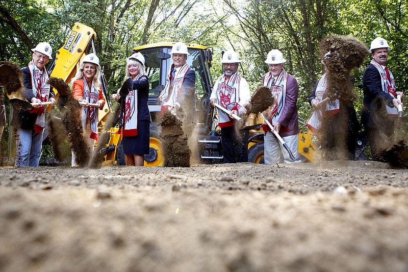 Staff photo by C.B. Schmelter / 
Elected officials toss dirt in the air for pictures with Gov. Bill Lee, center, and Chattanooga Red Wolves SC owner Bob Martino, center right, during a groundbreaking ceremony for the new Chattanooga Red Wolves SC stadium on Tuesday, July 9, 2019 in East Ridge, Tenn.