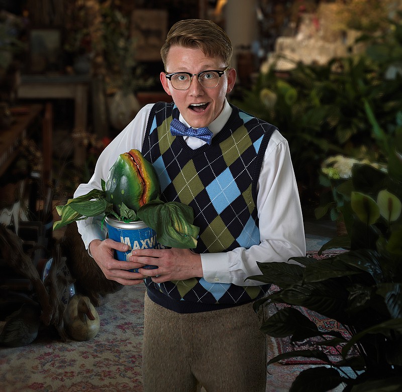 Garrett Henson-Hinck plays Seymour, a timid flower-shop clerk who stumbles upon a foul-mouthed, R&B-singing plant that grows into a monstrosity. / Brad Cansler Photo