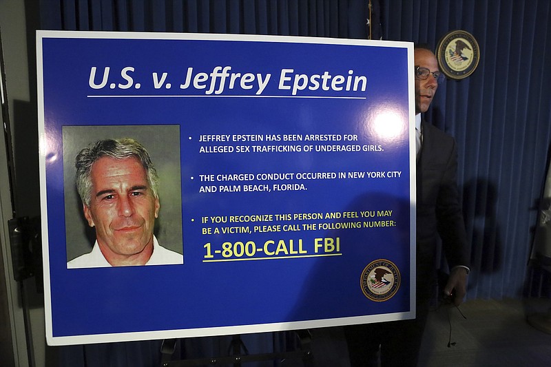A poster calling on victims of Jeffrey Epstein to contact the FBI, at a news conference where federal prosecutors announced the unsealing of sex trafficking charges against Jeffrey Epstein, in New York, July 8, 2019. Investigators seized nude photographs of underage girls from the Manhattan townhouse of Epstein as part of a new investigation into allegations he exploited dozens of minors for sex, prosecutors revealed on Monday. That detail was mentioned by the prosecutors on Monday as they unsealed the indictment of charges and made an appeal to other women who may have been abused by him as girls to come forward. (Jefferson Siegel/The New York Times)