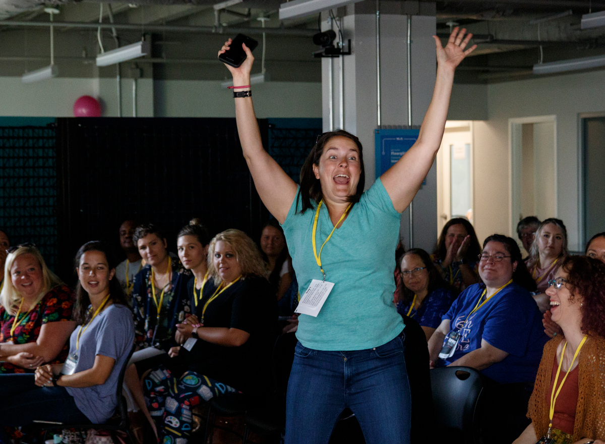 Kelly Munson reacts as she wins a door prize during Teach Like A Boss at The Edney Building on Tuesday, July 9, 2019, in Chattanooga, Tenn. The workshop for elementary school teachers featured a keynote speech from teacher Dwayne Reed, whose YouTube video "Welcome to the 4th Grade" became a viral sensation.