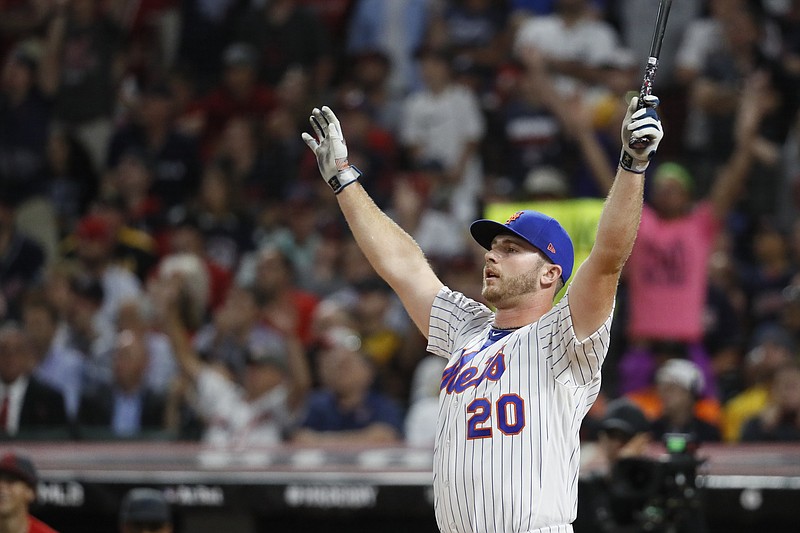 Pete Alonso, of the New York Mets, celebrates winning the Major League Baseball Home Run Derby, Monday, July 8, 2019, in Cleveland. The MLB baseball All-Star Game will be played Tuesday. (AP Photo/John Minchillo)

