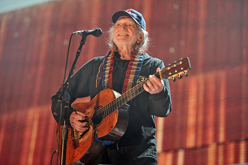 FILE - In this Sept. 19, 2015 file photo, Willie Nelson performs at Farm Aid 30 at FirstMerit Bank Pavilion at Northerly Island in Chicago. Nelson, John Mellencamp, Neil Young and Dave Matthews headline Farm Aid 2019 when the annual music and food festival visits Wisconsin's dairy country in September. Tickets for the Sept. 21 event at the Alpine Valley Music Theatre in East Troy, Wisconsin, go on sale Friday, July 12, 2019. (Photo by Rob Grabowski/Invision/AP, File)