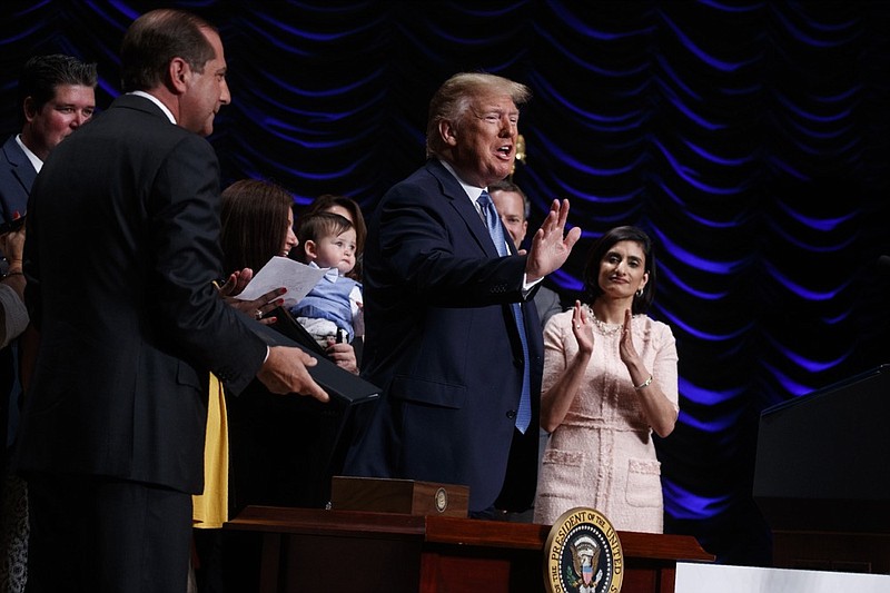 President Donald Trump waves after signing an executive order on kidney disease care during an event at the Ronald Reagan Building and International Trade Center, Wednesday, July 10, 2019, in Washington. (AP Photo/Evan Vucci)