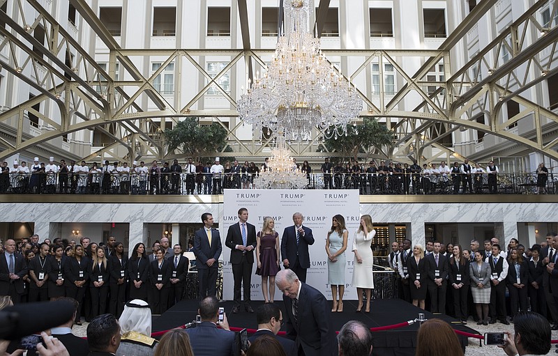 Donald Trump with his family during the ribbon cutting ceremony for the Trump International Hotel on Oct. 26, 2016. (Stephen Crowley/The New York Times)