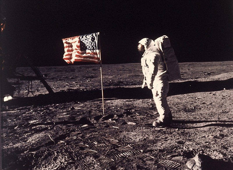 In this image provided by NASA, astronaut Buzz Aldrin poses for a photograph beside the U.S. flag deployed on the moon during the Apollo 11 mission on July 20, 1969. Television is marking the 50th anniversary of the July 20, 1969, moon landing with a variety of specials about NASA's Apollo 11 mission. (Neil A. Armstrong/NASA via AP, File)