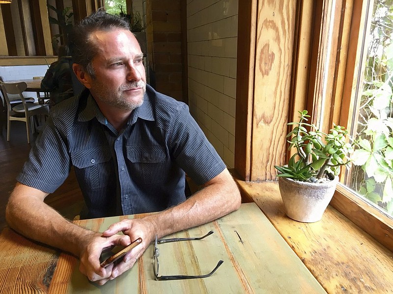 In this Monday, July 8, 2019 photo, Troy Young, a hemp grower in North Salt Lake, stops for breakfast at a nearby coffee shop before returning to his indoor grow facility. Young, who recently applied for a medical marijuana growers license in Utah, lost his mother to an opioid addiction. If she had access to less destructive pain-relieving drug, like marijuana, Young said maybe she'd still be alive. (AP Photo/Morgan Smith)