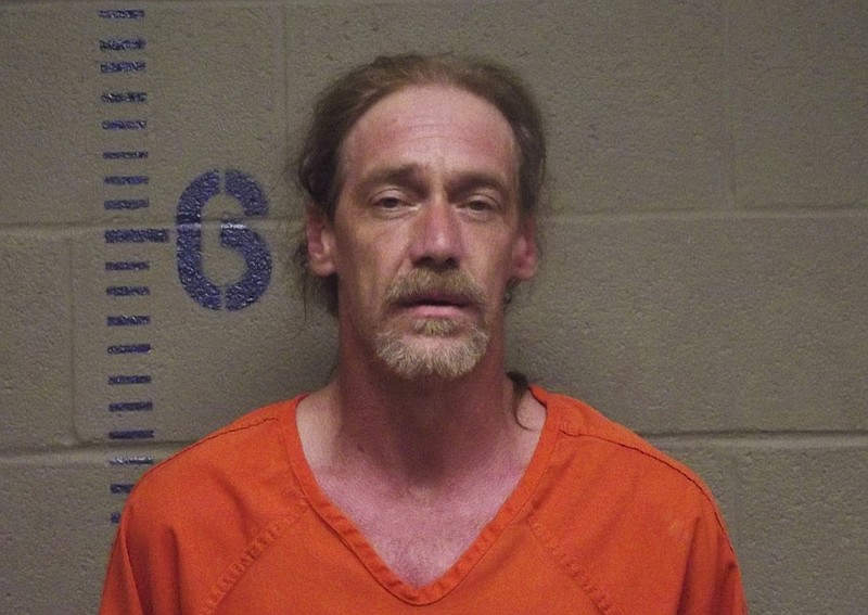 This photo provided by the Logan County Sheriff's Office in Oklahoma shows Stephen Jennings. Jennings was charged with possession of a stolen vehicle, transporting an open container of liquor and driving with a suspended license after police say they found a rattlesnake, a canister of radioactive powdered uranium and an open bottle of Kentucky Deluxe whiskey during a traffic stop of a vehicle that had been reported stolen. (Logan County, Oklahoma Sheriff's Office via AP)