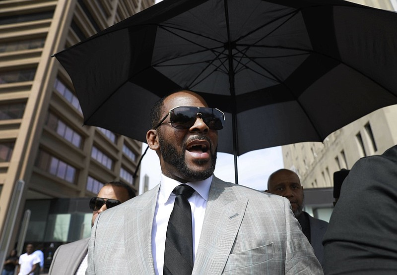 In this June 6, 2019, file photo, musician R. Kelly departs the Leighton Criminal Court building after pleading not guilty to 11 additional sex-related charges in Chicago. A U.S. Attorney s office spokesman says Kelly was arrested Thursday night, July 11 on federal sex-crime charges in Chicago. (AP Photo/Amr Alfiky, File)