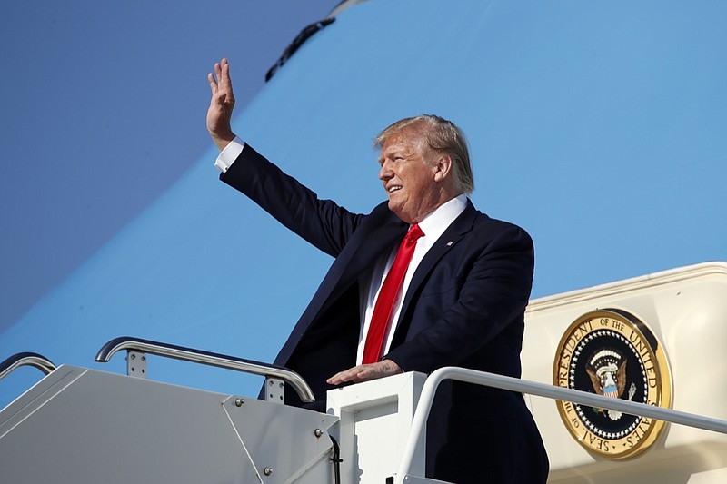 President Donald Trump waves as he steps off Air Force One as he arrives at Cleveland-Hopkins International Airport, Friday, July 12, 2019, in Cleveland. (AP Photo/Alex Brandon)