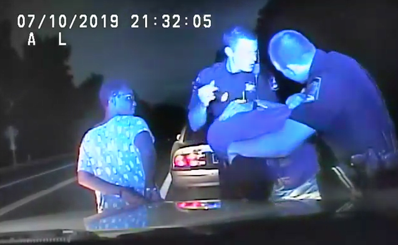 This screenshot from dashcam footage provided by the Office of District Attorney General Neal Pinkston shows the arrest of a man and woman who were pulled over Wednesday in the Soddy-Daisy area. 
