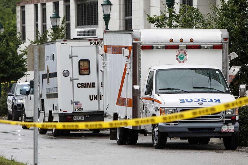 Crime scene tape is draped around University Street on Sunday, July 14, 2019 in Chattanooga, Tenn. Three people were injured in a shooting inside a Douglas Heights apartment Sunday morning just before 4 a.m. One person is said to be in critical condition.