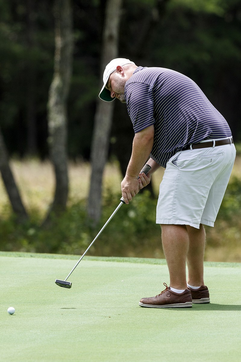 Richard Spangler putts on the 16th green during the Chattanooga Men's Metro golf tournament at The Course at McLemore on Sunday in Rising Fawn, Ga.