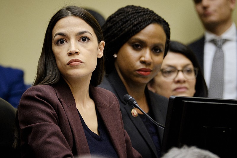 FILE — From left, Reps. Alexandria Ocasio-Cortez (D-N.Y.), Ayanna Pressley (D-Mass.) and Rashida Tlaib (D-Mich.), along with Rep. Ilan Omar (D-Minn.) have become targets of President Trump's Twitter contempt. (T.J. Kirkpatrick/The New York Times)