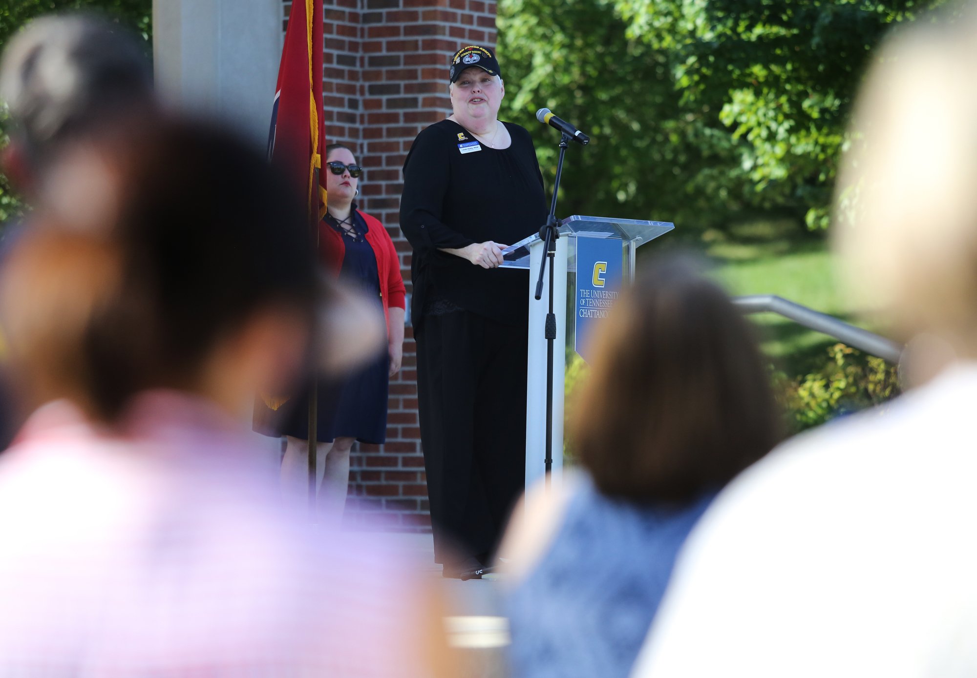 Linda Hinkle, the coordinator for Veteran Students Services at the University of Tennessee at Chattanooga, speaks during a ceremony to remember the Fallen Five at Chamberlain Field Pavilion at UTC in Chattanooga, Tennessee. UTC staff, students and community members joined in to honor the four Marines and Sailor who lost their lives July 16, 2015 in an attack on two Chattanooga military facilities.