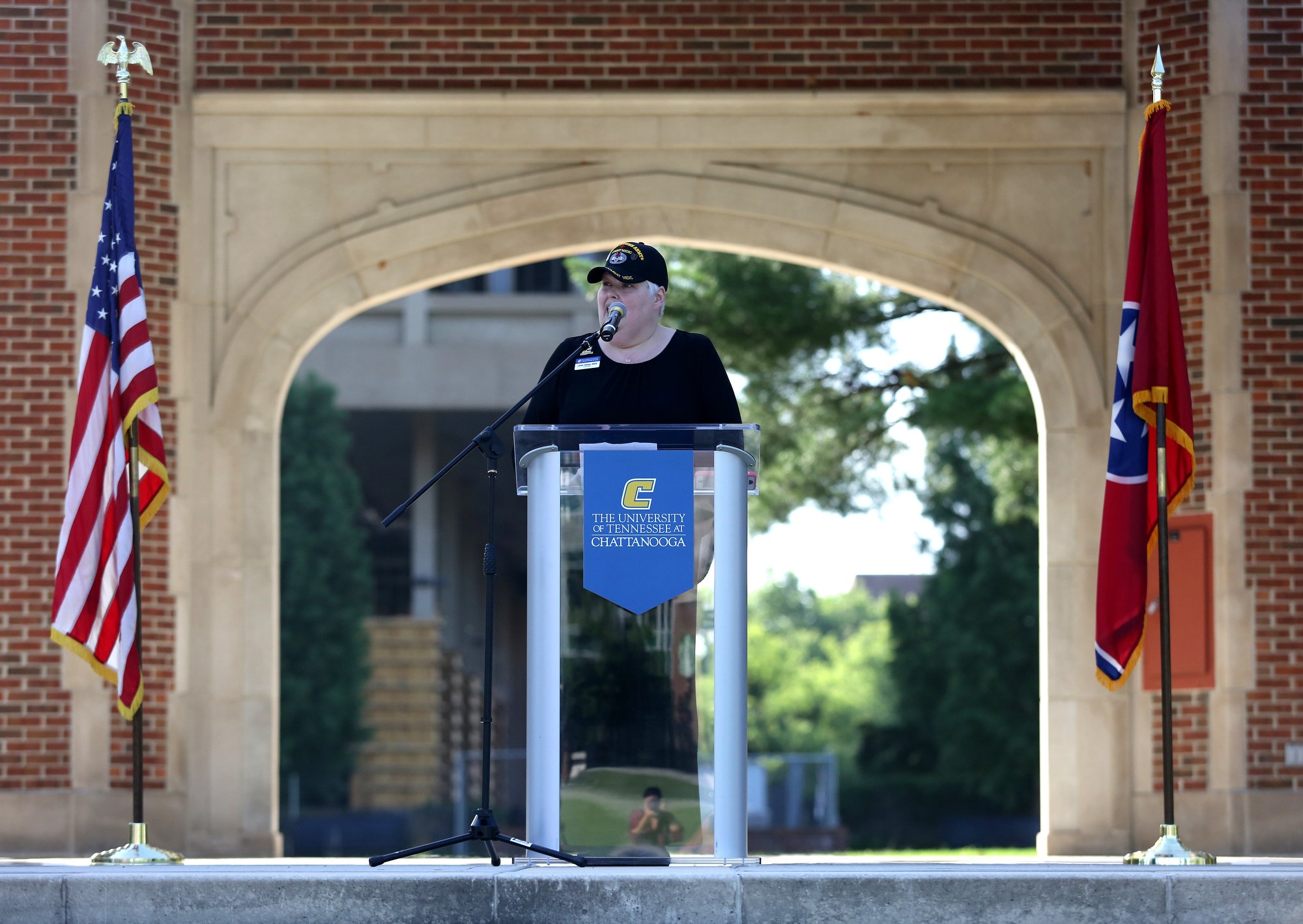 Linda Hinkle, the coordinator for Veteran Students Services at the University of Tennessee at Chattanooga, opens up a ceremony to remember the Fallen Five at Chamberlain Field Pavilion at UTC in Chattanooga, Tennessee. UTC staff, students and community members joined in to honor the four Marines and Sailor who lost their lives July 16, 2015 in an attack on two Chattanooga military facilities.