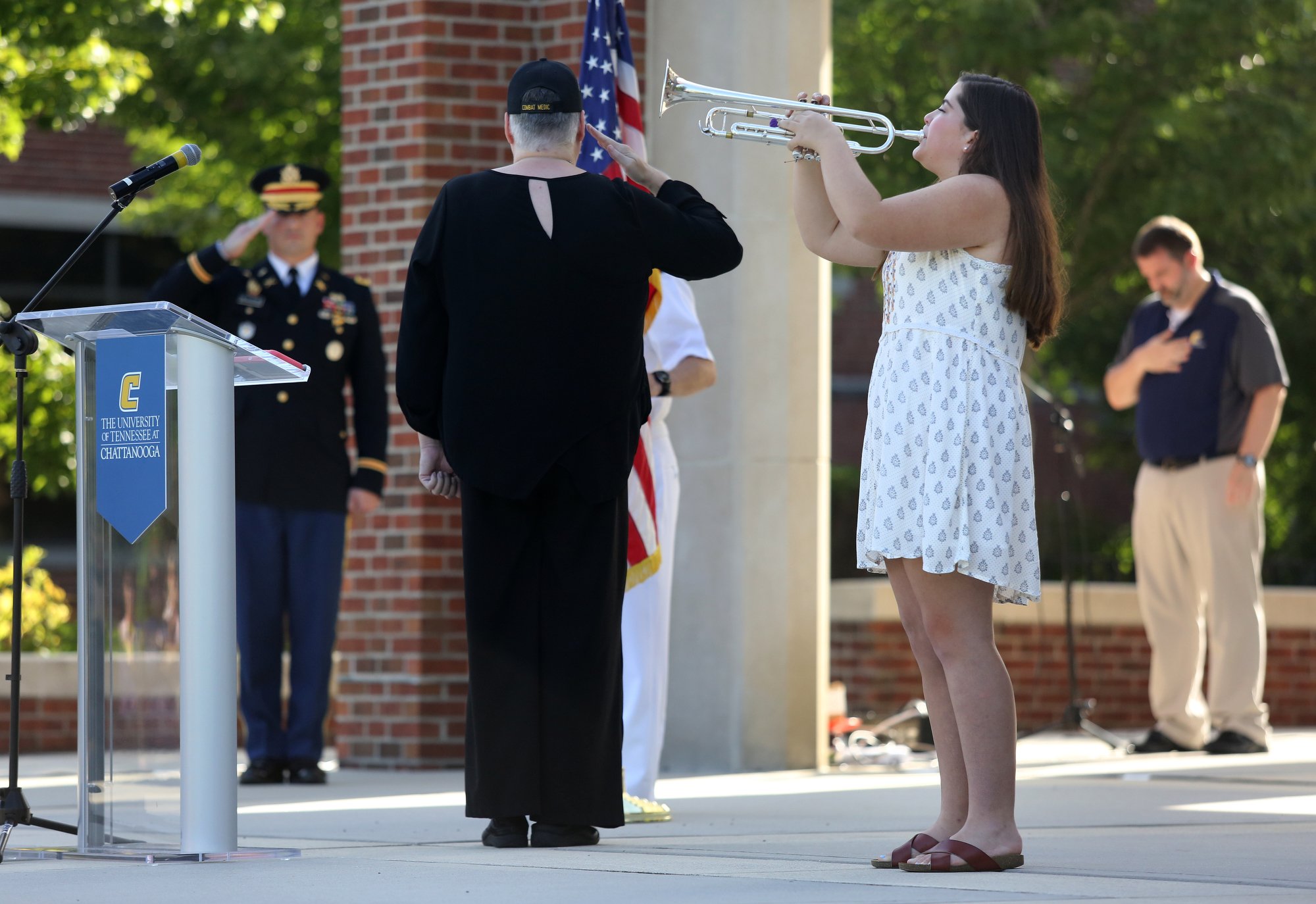 Molly Ragon, a recent Gordon Lee High School graduate, plays Taps during a ceremony to remember the Fallen Five at Chamberlain Field Pavilion at the University of Tennessee at Chattanooga. UTC staff, students and community members joined in to honor the four Marines and Sailor who lost their lives July 16, 2015 in an attack on two Chattanooga military facilities. Ragon will be attending Johns Hopkins University majoring in trumpet performance and music education.