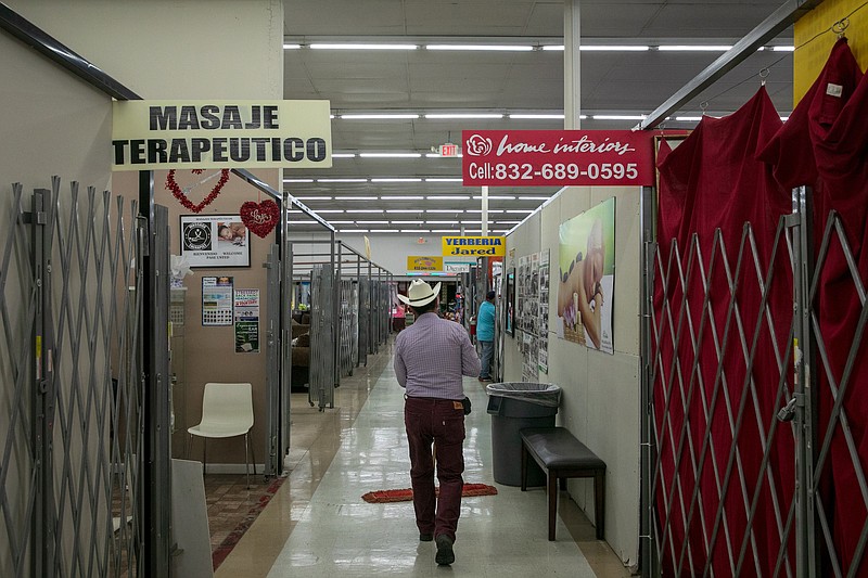 Inside La Estrella Flea Market in Houston last Sunday. Federal raids targeting undocumented parents and their children began over the weekend, part of President Donald Trump's pledge to swiftly enforce deportation orders against migrants who are not eligible to remain in the country. (Ilana Panich-Linsman/The New York Times)