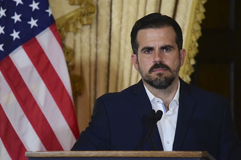 Puerto Rico governor Ricardo Rossello holds a press conference, almost two days after federal authorities arrested the island's former secretary of education and five other people on charges of steering federal money to unqualified, politically connected contractors, in San Juan, Puerto Rico, Thursday, July 11, 2019. At the time of the arrests, Rossello was in the middle of a family vacation in France, which he canceled to travel back to the Island. U.S. Attorney for Puerto Rico Rosa Emilia Rodr guez said Gov. Ricardo Rossello was not involved in the investigation. (AP Photo/Carlos Giusti)