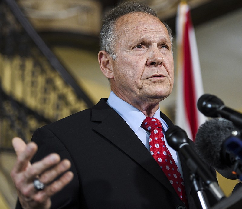 In this June 20, 2019, photo, former Alabama Chief Justice Roy Moore announces his run for the republican nomination for U.S. Senate in Montgomery, Ala. Moore has raised less than $17,000 for his U.S. Senate race, according to quarterly campaign reports filed this week. (AP Photo/Julie Bennett)