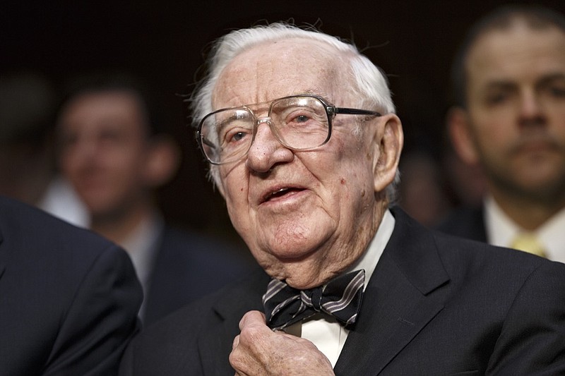 In this April 30, 2014 file photo, retired Supreme Court Justice John Paul Stevens prepares to testify on the ever-increasing amount of money spent on elections as he appears before the Senate Rules Committee on Capitol Hill in Washington. Stevens, the bow-tied, independent-thinking, Republican-nominated justice who unexpectedly emerged as the Supreme Court's leading liberal, died Tuesday, July 16, 2019, in Fort Lauderdale, Fla., after suffering a stroke Monday. He was 99. (AP Photo, File)