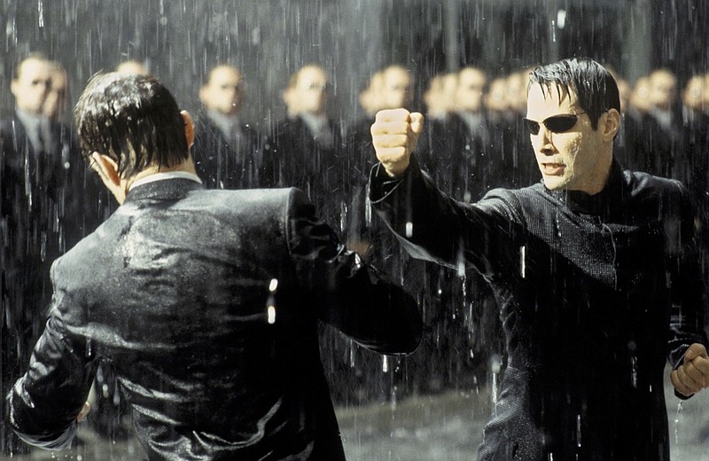 Keanu Reeves, right, punches Hugo Weaver in a scene from the Warner Bros. Pictures movie "The Matrix Revolutions." The third film in the "Matrix" series, it hits theaters this fall. (AP Photo/Warner Bros. Pictures, Jasin Boland)