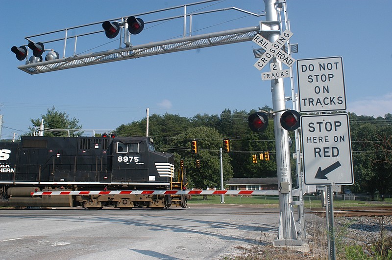 A Norfolk Southern train approaches the railroad crossing at the intersection of Harrison Lane and Daisy Dallas Road in Soddy-Daisy. Area residents complain the nearby crossing at Thrasher Pike backs up traffic onto Highway 27.