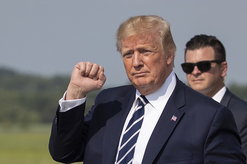 President Donald Trump gestures upon arrival at Morristown Municipal Airport, in Morristown, N.J., Friday, July 19, 2019. (AP Photo/Manuel Balce Ceneta)