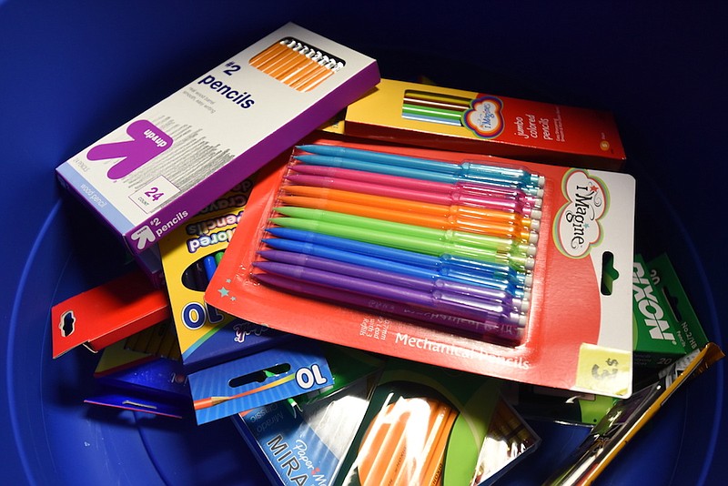 School supplies are sorted in bins during the United Way day of caring in 2015 at the Teacher Supply Depot on Roanoke Avenue.