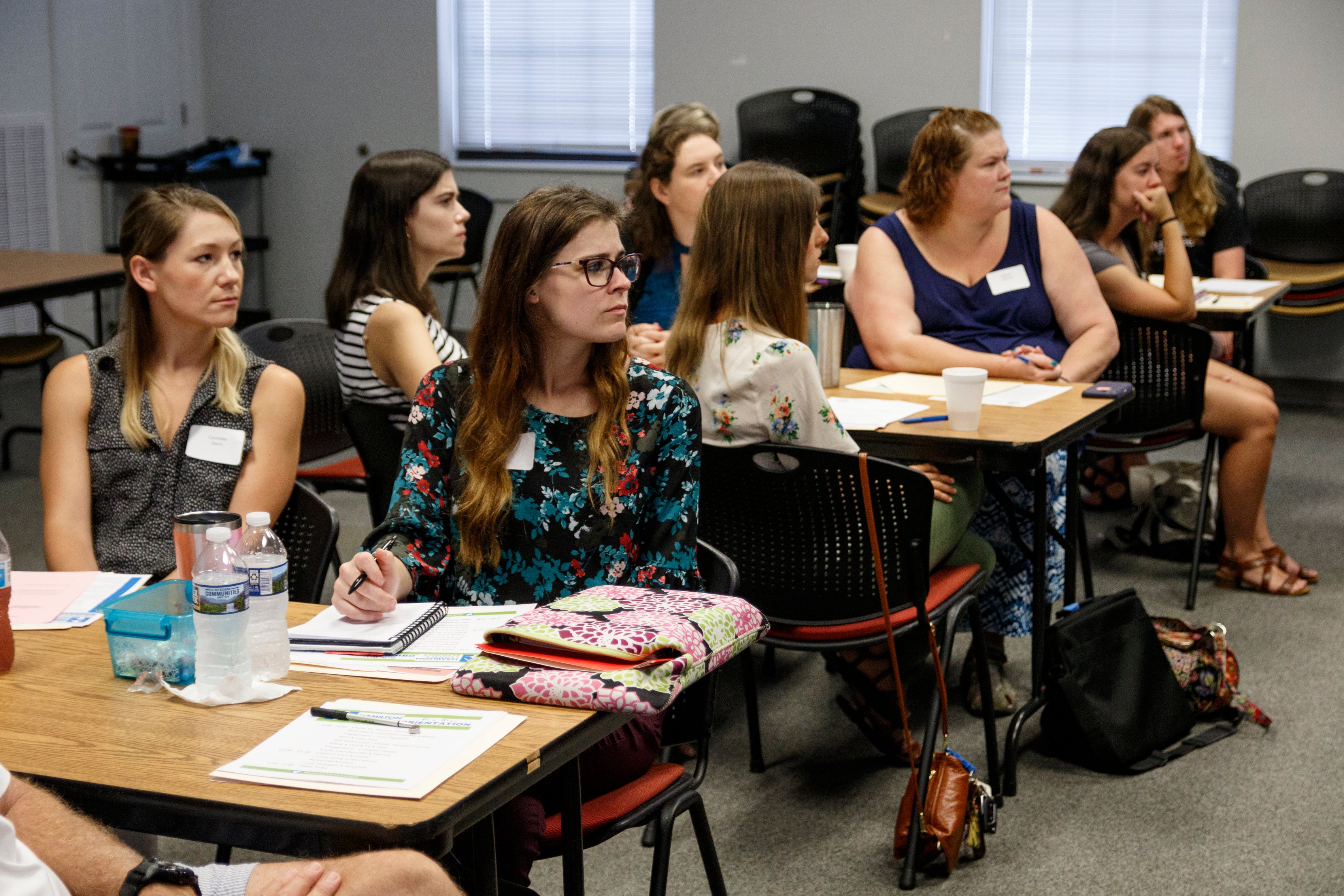 Educators listen during a new hire orientation at Hamilton County Schools Central Office on Wednesday, July 10, 2019, in Chattanooga, Tenn. Teachers and central office hires learned about working for the department during the orientation.