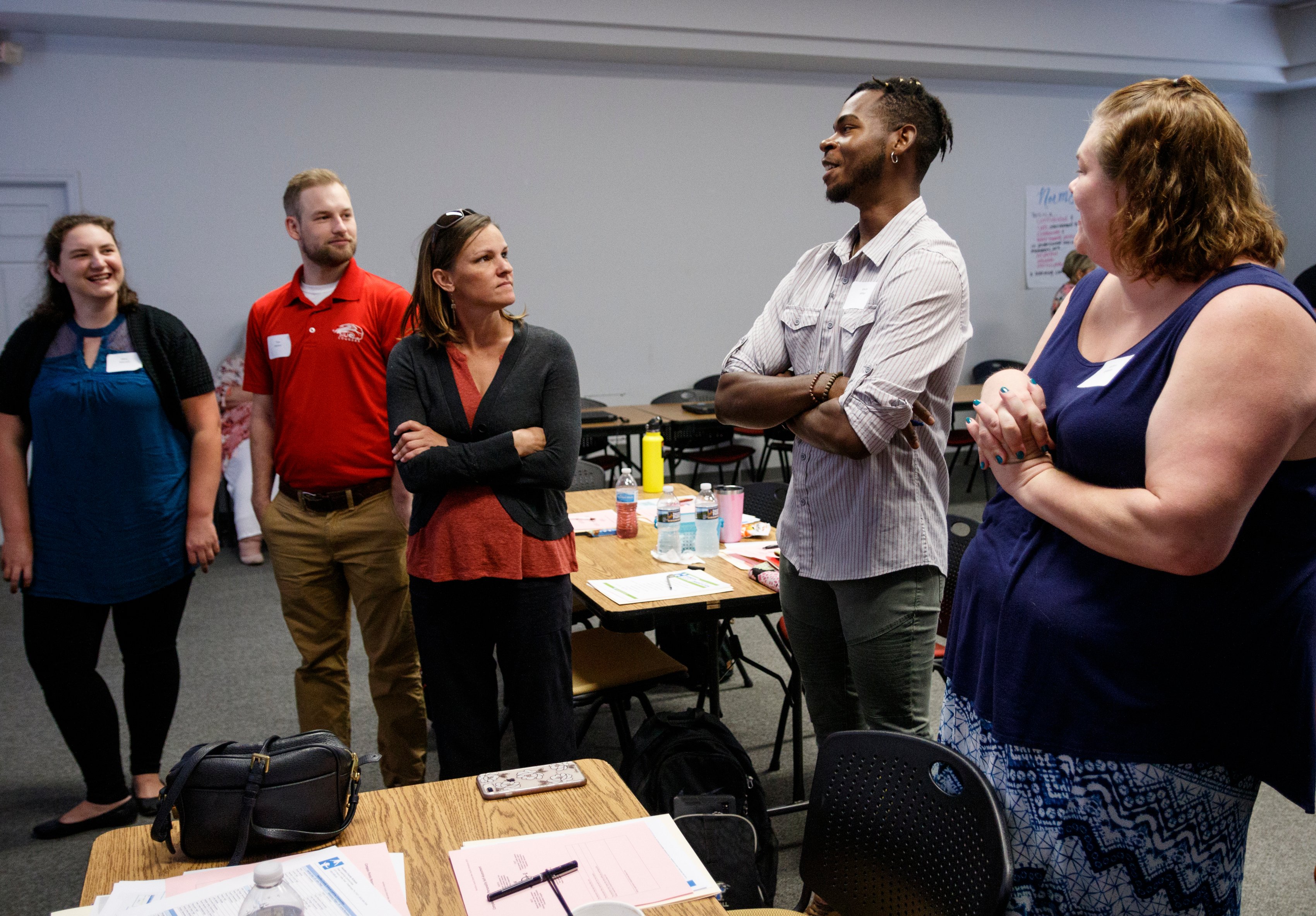 Educators participate in an icebreaker during a new hire orientation at Hamilton County Schools Central Office on Wednesday, July 10, 2019, in Chattanooga, Tenn. Teachers and central office hires learned about working for the department during the orientation.
