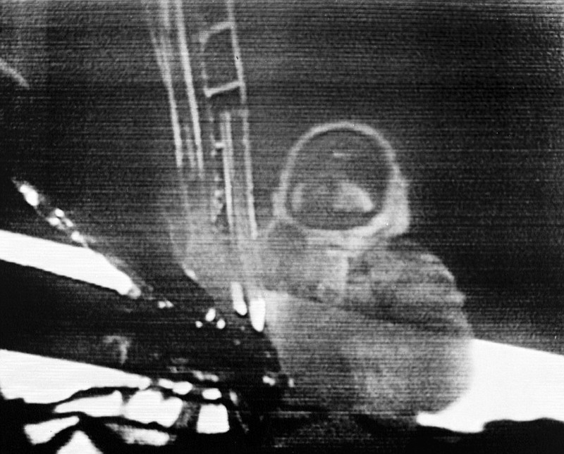 In this July 20, 1969, image made from television, Apollo 11 astronaut Neil Armstrong steps onto the surface of the moon. Millions on Earth who gathered around the TV and radio heard Armstrong say this: "That's one small step for man, one giant leap for mankind." But after returning from space, he immediately insisted that he had been misquoted. He said there was a lost word in his famous one-liner from the moon: "That's one small step for 'a' man." It's just that people just didn't hear it." (NASA via AP)