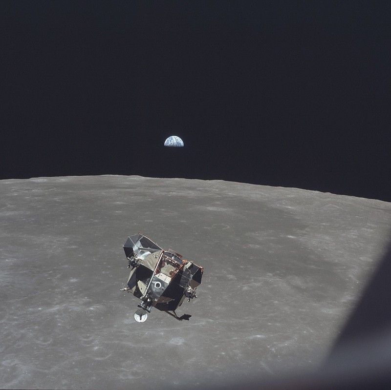 In this July 21, 1969, photo made available by NASA, the Apollo 11 Lunar Module ascent stage, carrying astronauts Neil Armstrong and Buzz Aldrin, approaches the Command and Service Modules for docking in lunar orbit. Astronaut Michael Collins remained with the CSM in lunar orbit while the other two crewmen explored the moon's surface. In the background the Earth rises above the lunar horizon. (Michael Collins/NASA via AP)