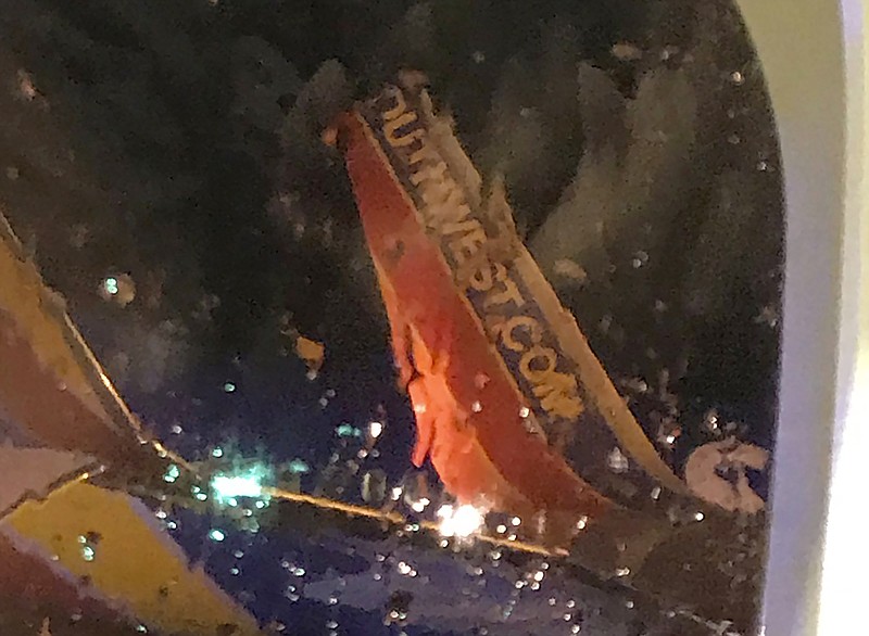 This photo taken onboard by a passenger on a Southwest Airlines flight to Atlanta appears to show the top fin of another Southwest Airlines plane clipped off after the two planes collided, Saturday, July 20, 2019, on the tarmac of Nashville International Airport, in Nashville, Tenn. The airline says both planes returned to the gate "under their own power" and were taken out of service for evaluation. The Southwest flights will continue to the scheduled destinations using news planes. (Eric Borden via AP)

