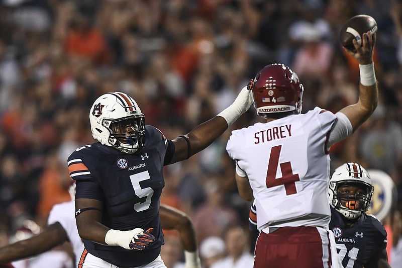 Auburn defensive tackle Derrick Brown decided to come back for his senior season despite lofty NFL draft projections and having an infant son.