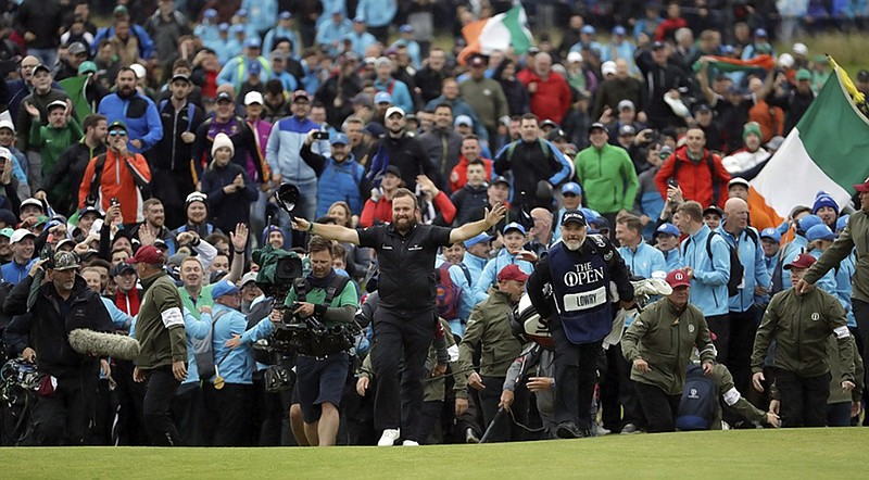 Shane Lowry walks across the 18th green Sunday at Northern Ireland's Royal Portrush Golf Club on his way to winning the British Open in front of an enthusiastic crowd.