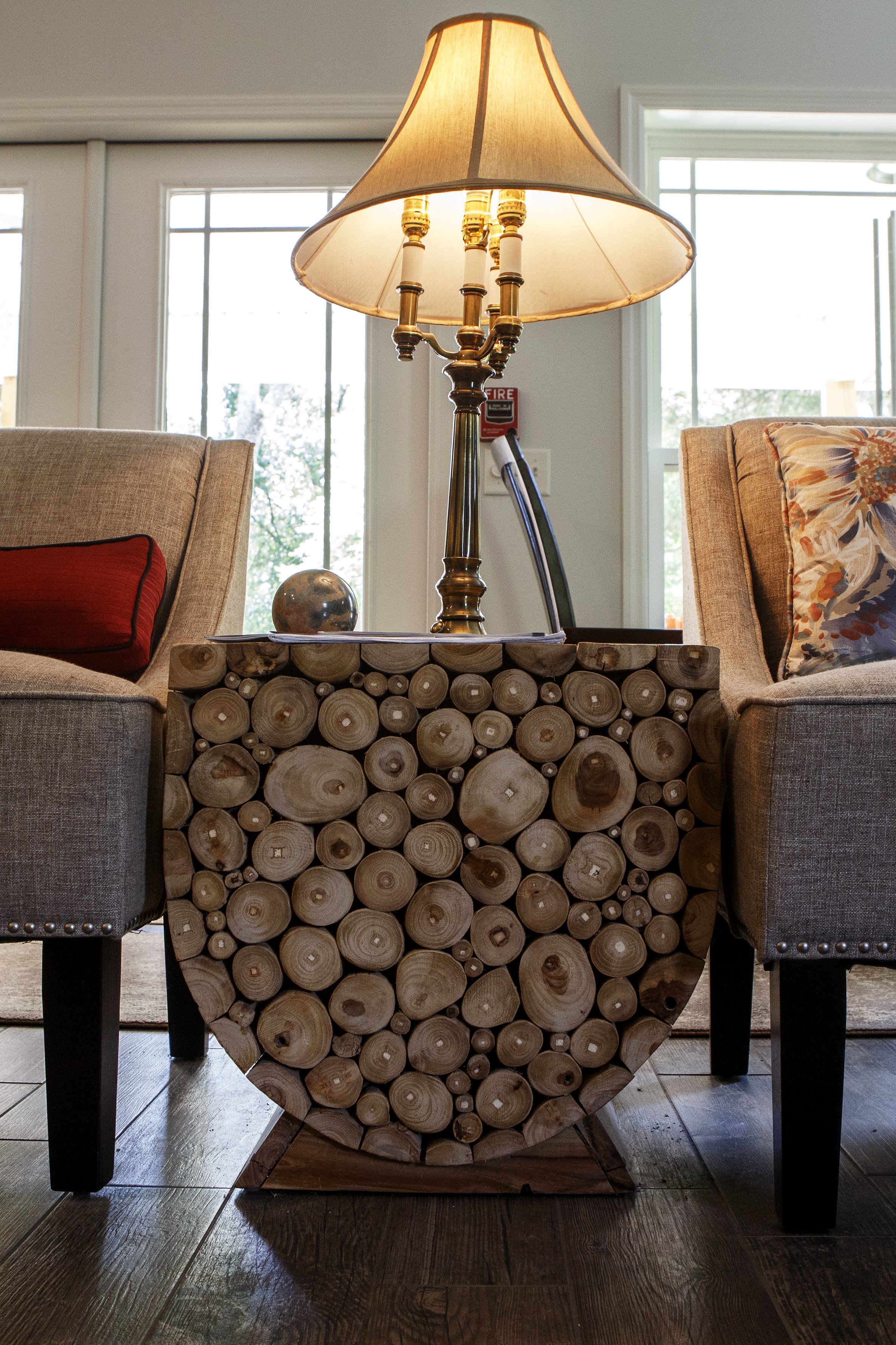 Owners Wallace and Nancy Braud have several pieces sold under the brand name Jeffan. Three side tables in the sitting area are made of a bundle of olive branches contained in a wooden sleeve.