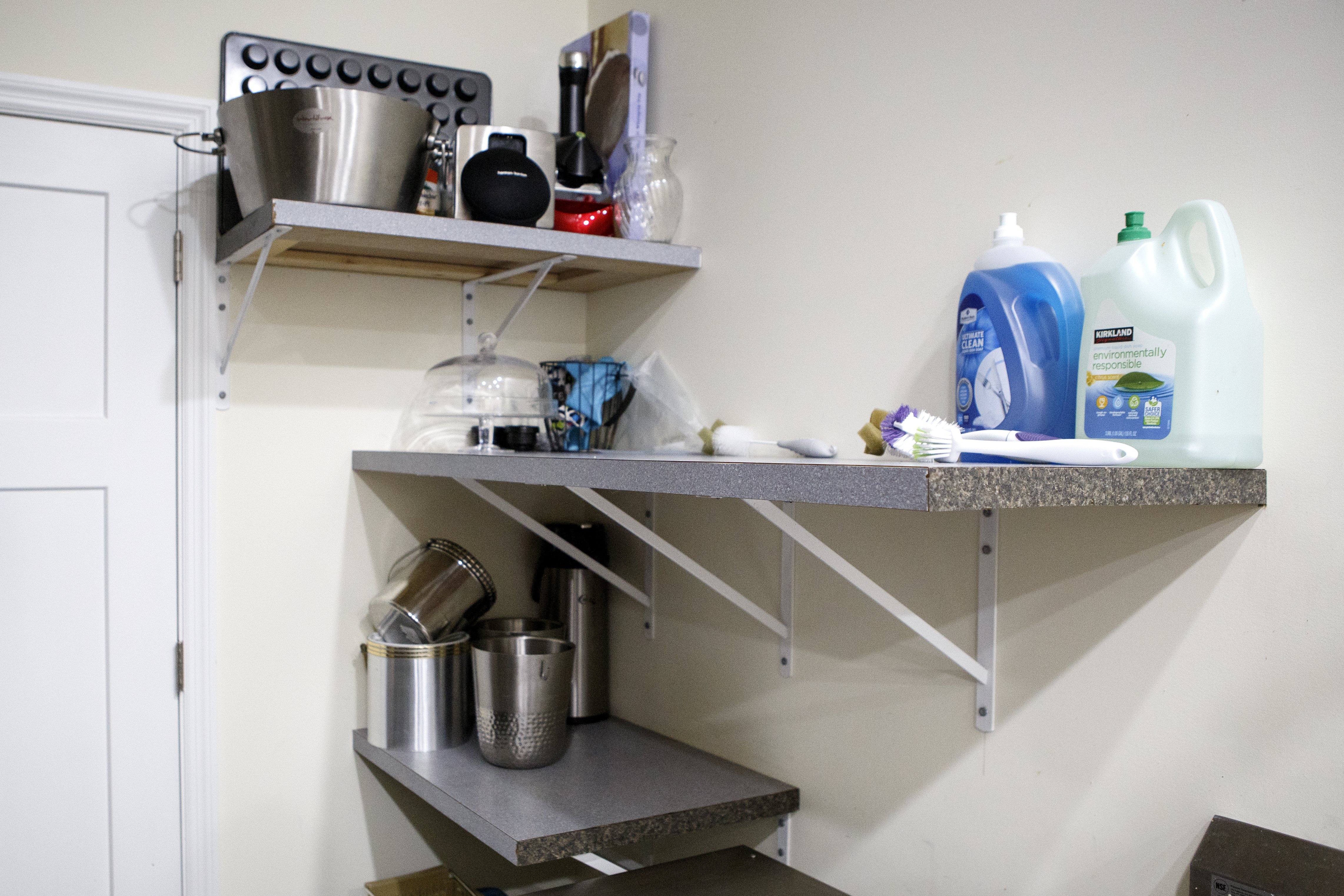 In addition to furniture and decorative pieces, Wallace and Nancy Braud found pieces for utilitarian use at resale stores, including this shelving.