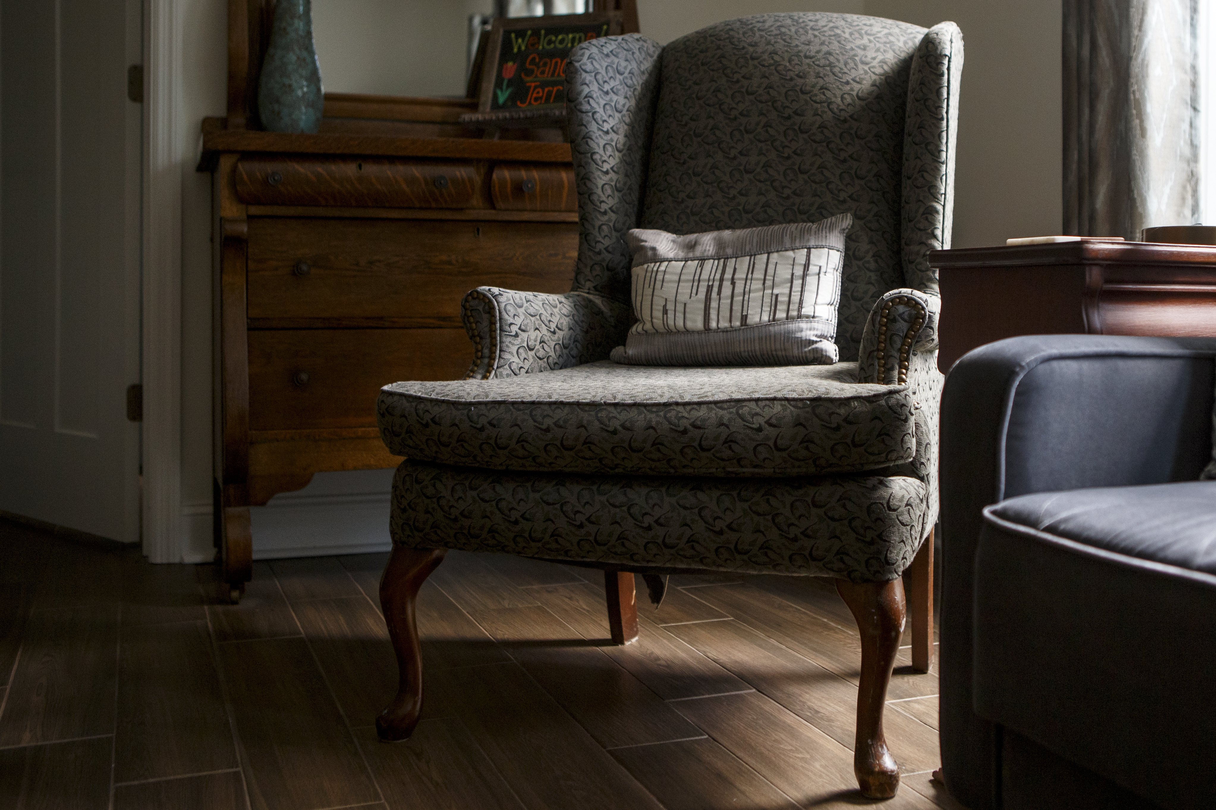 A wingback chair in the Monarch Room at St. Francis Cottage was among Wallace and Nancy Braud's secondhand finds.