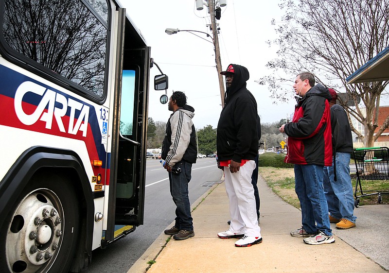 A line of people wait to get on a CARTA bus on route 4 Wednesday, February 27, 2019 in Chattanooga, Tennessee. The number of riders on the bus varies throughout the day.