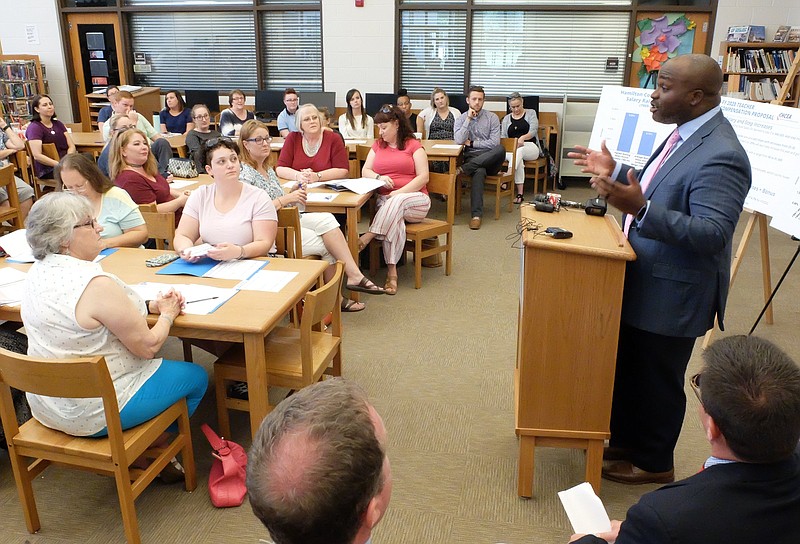 Midday Wednesday at Hixson Middle School, teachers listen as school superintendent Dr. Bryan Johnson speaks to the budget that will be given to the Hamilton County Commission / Staff photo by Tim Barber